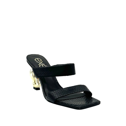 Black: EXE Dolly-155 double-strap chain-link heel slide sandal in black with textured upper and gold sculptural chain-link heel, side view