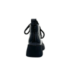 BONAVI Wren genuine leather combat boot in black patent with pull tab and block heel, rear view