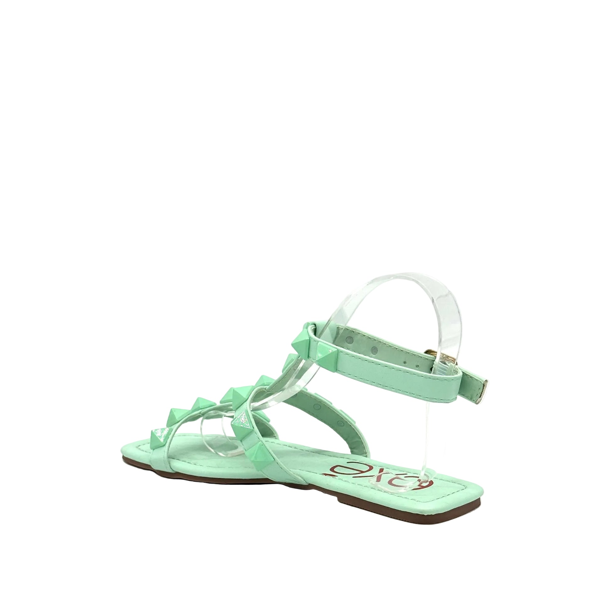 Mint: EXE 2269-2781 pyramid stud T-strap flat sandal in mint with gold-tone ankle buckle and square toe, side view