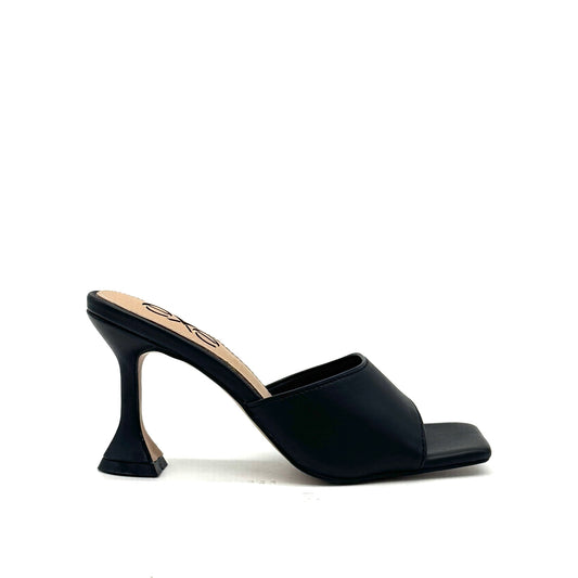 Black: EXE Bianca-700 wide-band sculptural heel slide sandal in black with flared heel and square toe, side view