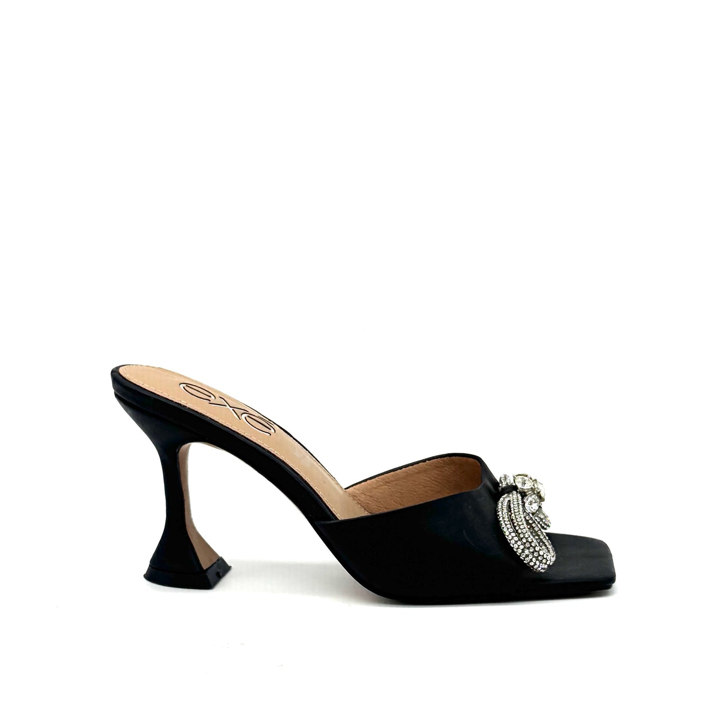 Black: EXE Bianca-755 crystal brooch heeled slide sandal in black with rhinestone tassel embellishment and sculptural flared heel, side view