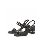 EXE Bruna 520 textured block heel sandal in black with geometric buckle hardware, alternate angled view