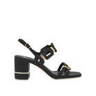 EXE Bruna 520 textured block heel sandal in black with geometric buckle hardware, side view