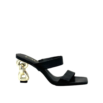 Black: EXE Dolly-155 double-strap chain-link heel slide sandal in black with textured upper and gold sculptural chain-link heel, side view