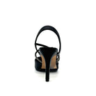 Black: EXE Garde-294 black pointed toe slingback heel with rhinestone strap detail