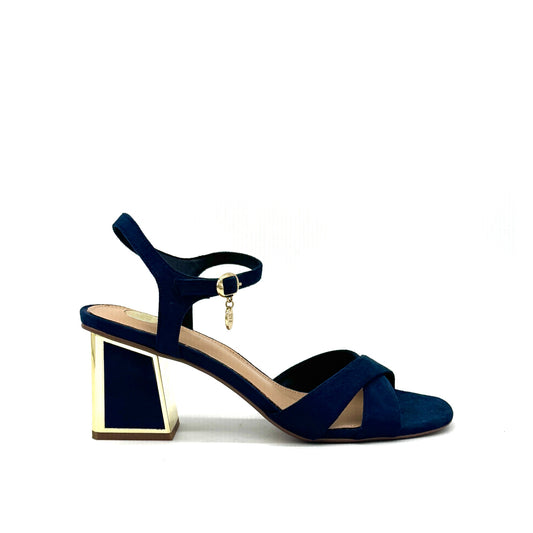 Navy: EXE Mina-190 cross-strap block heel sandal in navy with gold-mirrored heel and ankle strap charm detail, side view
