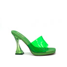 Green: EXE Steven-830 clear sculptural heel platform slide in neon green with transparent vinyl upper, side view
