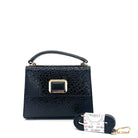 Black patent leather Karya Mila top handle satchel with embossed texture and gold hardware