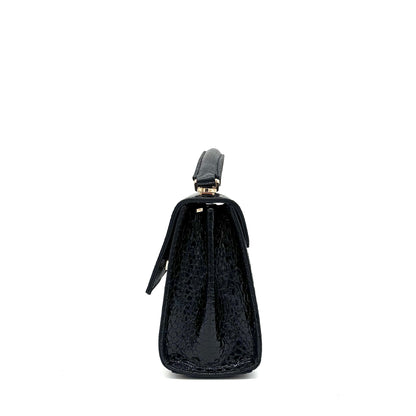 Black patent leather Karya Mila top handle satchel with embossed texture and gold hardware