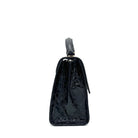 Black patent croc-embossed Karya Vera top handle satchel with gold clasp hardware