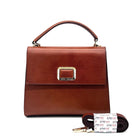Cognac genuine leather Karya Vera top handle satchel with gold hardware and detachable crossbody strap