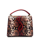 Red multicolor snake-embossed Karya Vera top handle satchel with red leather handle and gold hardware