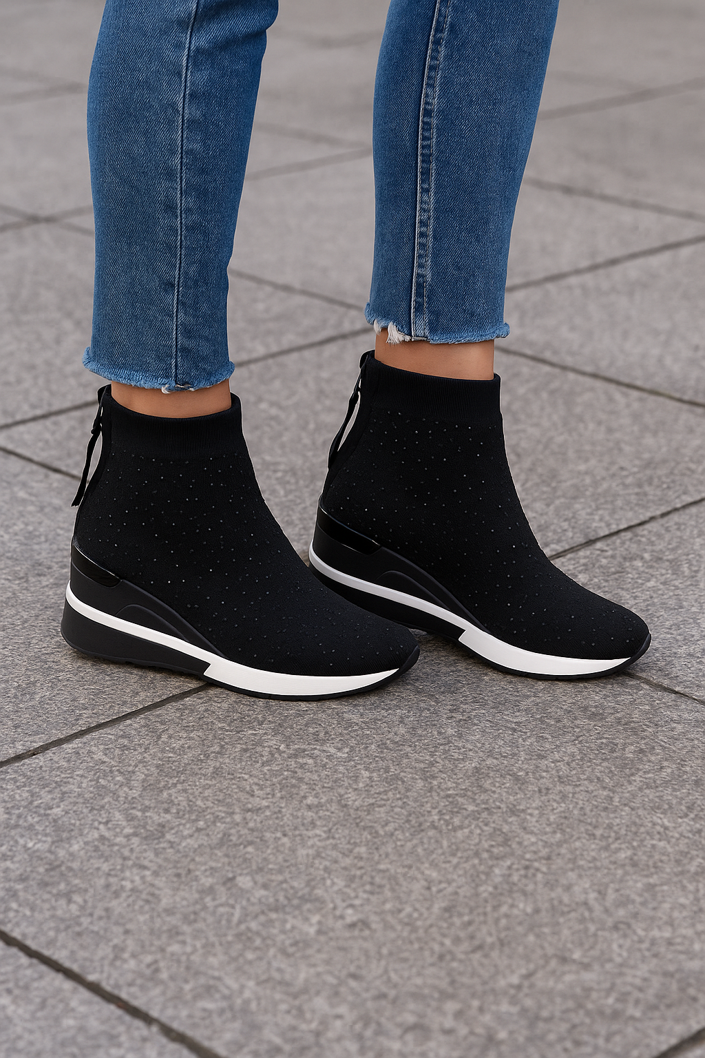 Renato Garini 34-210B black crystal knit wedge sneaker boots worn with cropped blue jeans, showing the ankle-high silhouette and contrasting sole stripe