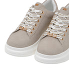 Close-up of Renato Garini EX166 beige platform sneakers showing lace-up fronts, gold-tone details and rounded toes