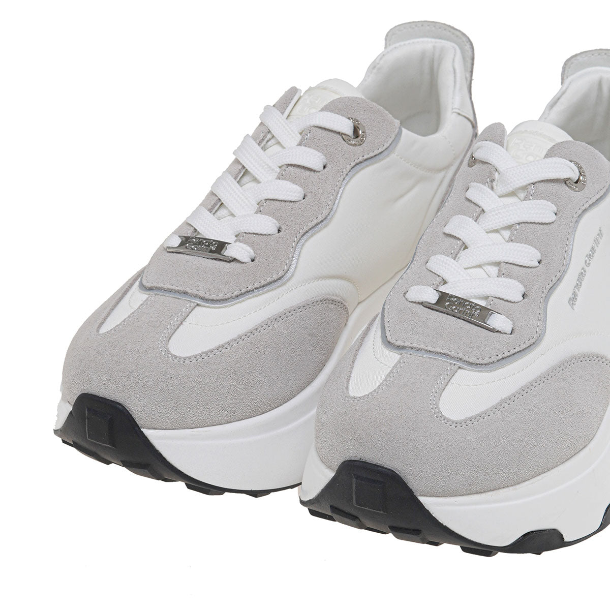 RENATO GARINI EX34 gray wedge sneakers, cropped close-up of the pair showing white laces, layered toe panels and silver-tone details