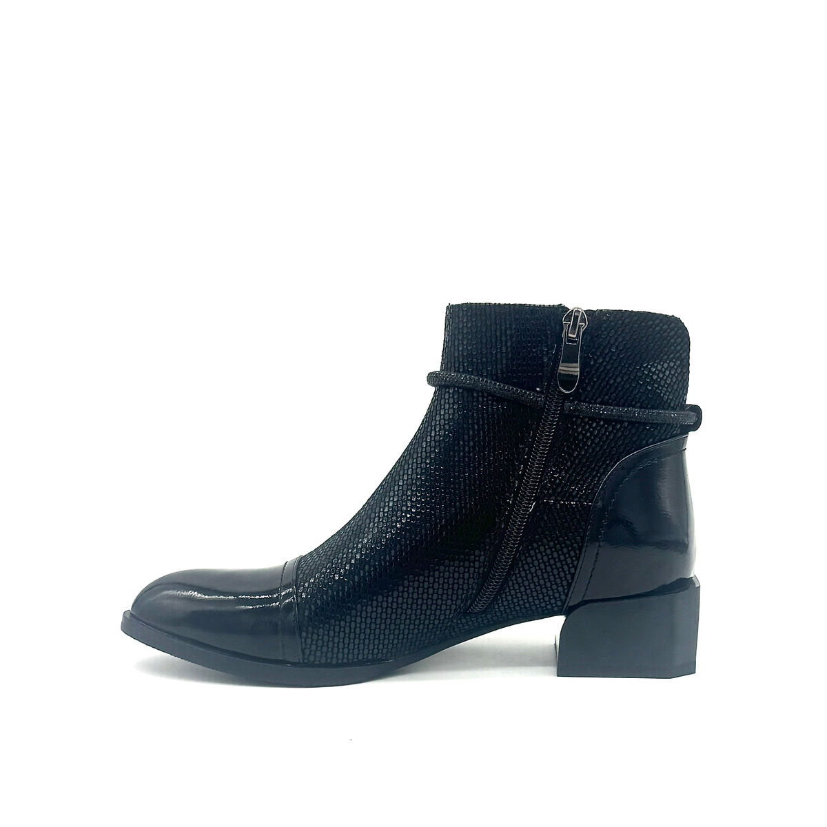Spring Step Shelbi genuine leather ankle boot in black with patent cap toe, studded ankle strap and block heel, inside profile