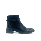 Spring Step Shelbi genuine leather ankle boot in black with patent cap toe, studded ankle strap and block heel, side view