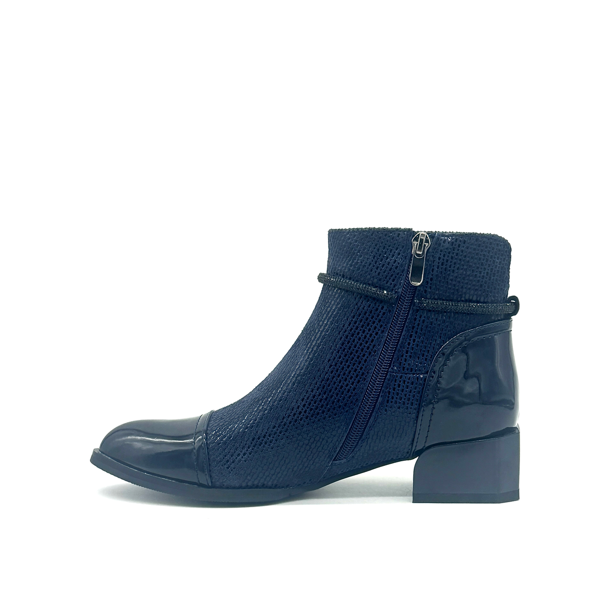 Spring Step Shelbi genuine leather ankle boot in navy with patent cap toe, studded ankle strap and block heel, inside profile