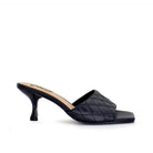 Black: EXE Jennifer-566 quilted slide mule in black with square toe and sculptural low heel