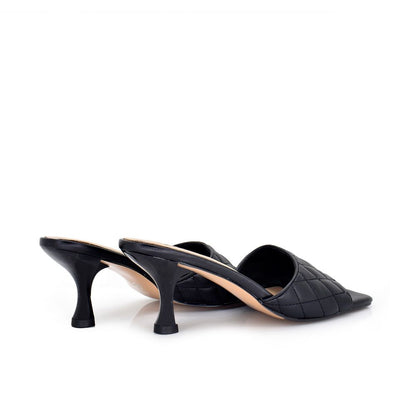 Black: EXE Jennifer-566 quilted slide mule in black with square toe and sculptural low heel