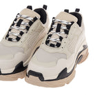 Close-up of Renato Garini 007-03AAV beige chunky sneakers showing patterned laces, mesh-textured toe panels and black accents