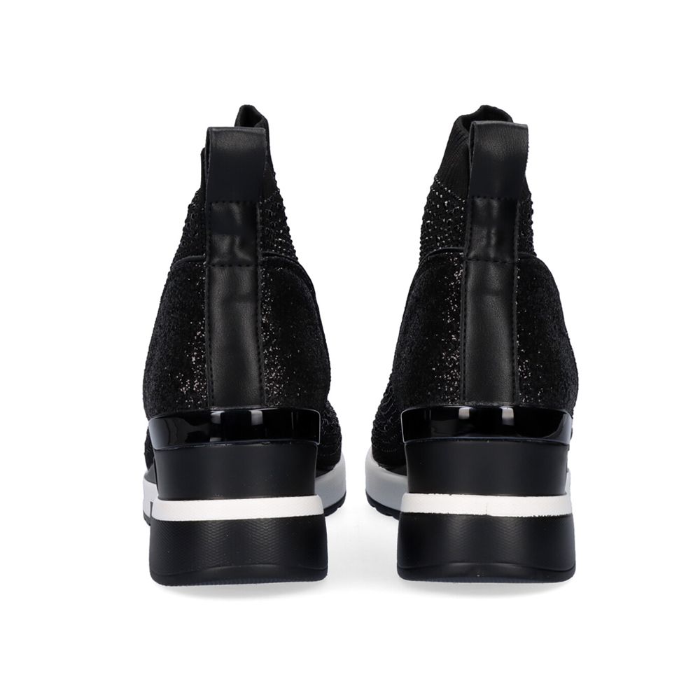 Renato Garini EX02B black sock wedge ankle boots, rear view showing heel pull tabs, sparkling panels and white stripes across the soles