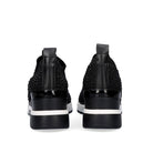 Renato Garini WEX22 black slip-on wedge sneakers, rear view showing heel pull tabs, glossy heel trim and black-and-white soles