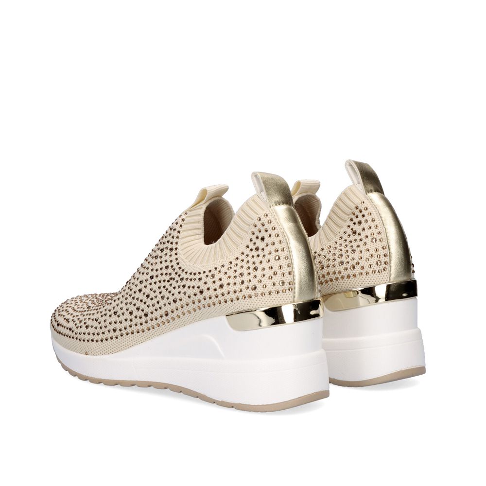 Pair of Renato Garini WEX22 gold rhinestone slip-on sneakers from a rear three-quarter angle, showing metallic heel trim and white wedge soles