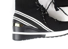 Close-up of Renato Garini WEX23 black high-top wedge sneaker showing white diagonal stripes, metallic heel accent and raised black-and-white sole