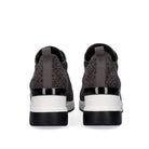 Rear view of Renato Garini WEX24 grey wedge sneakers showing rhinestone heel panels, pull tabs and contrasting black-and-white soles
