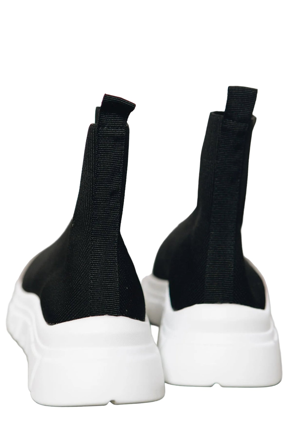 Renato Garini WEX48 black stretch-knit high-top sneakers showing back pull tabs, vertical heel seams and thick white wedge soles, pair viewed from the rear